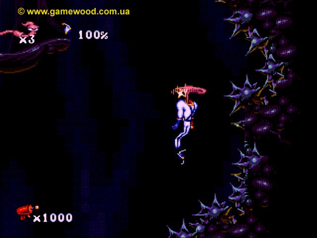 Скриншот игры Earthworm Jim («Червяк Джим») | Sega Mega Drive 2 (Genesis) | Парящий в воздухе